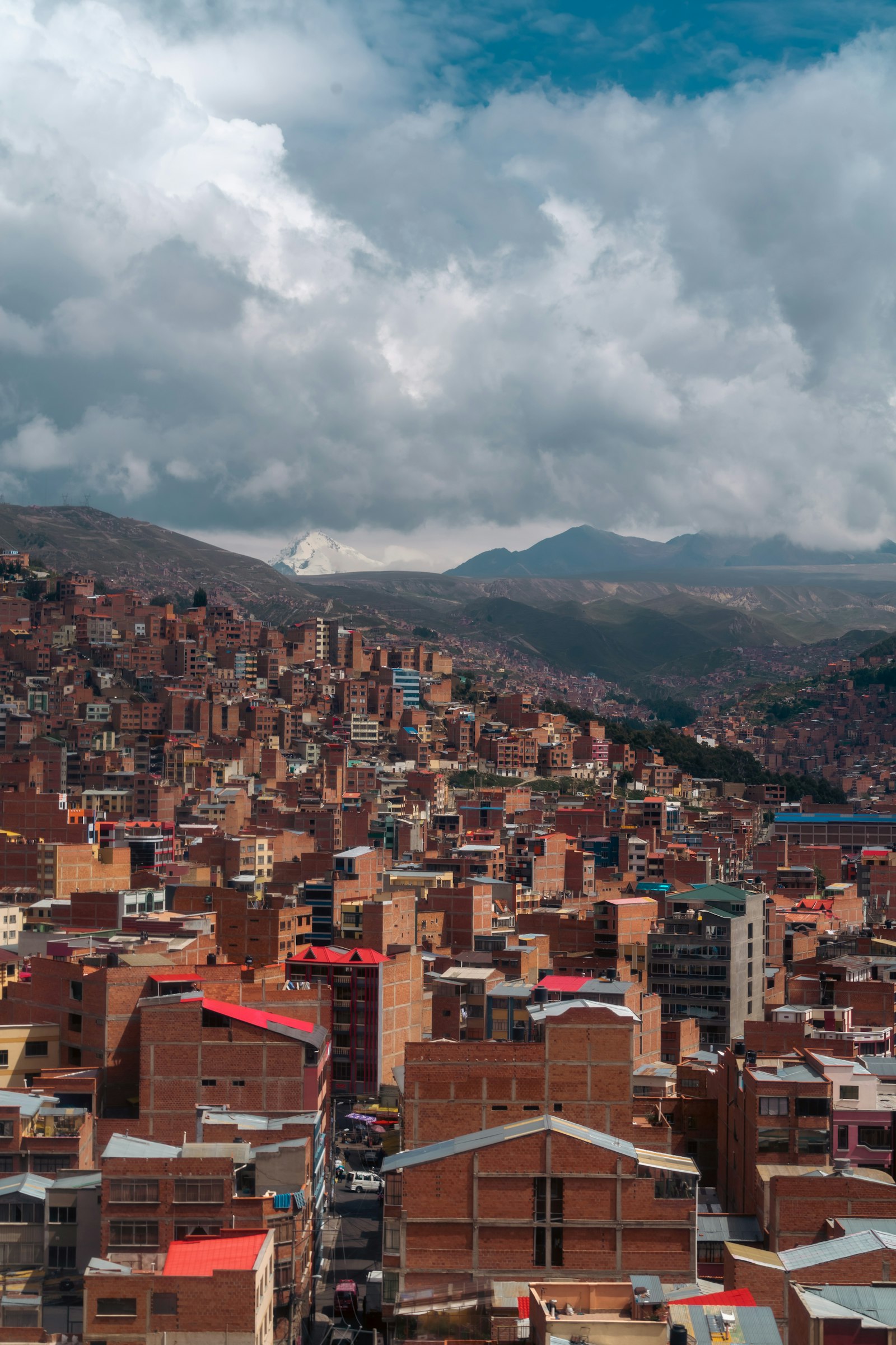 Modern residential towers in Bolivia with mountains in the background